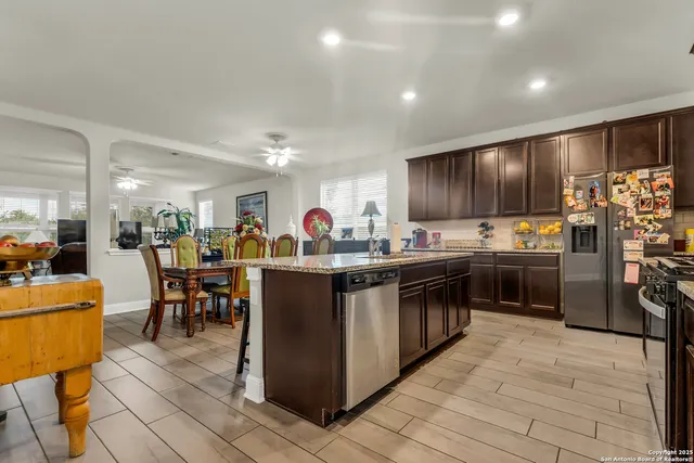 a kitchen with lots of counter top space and appliances