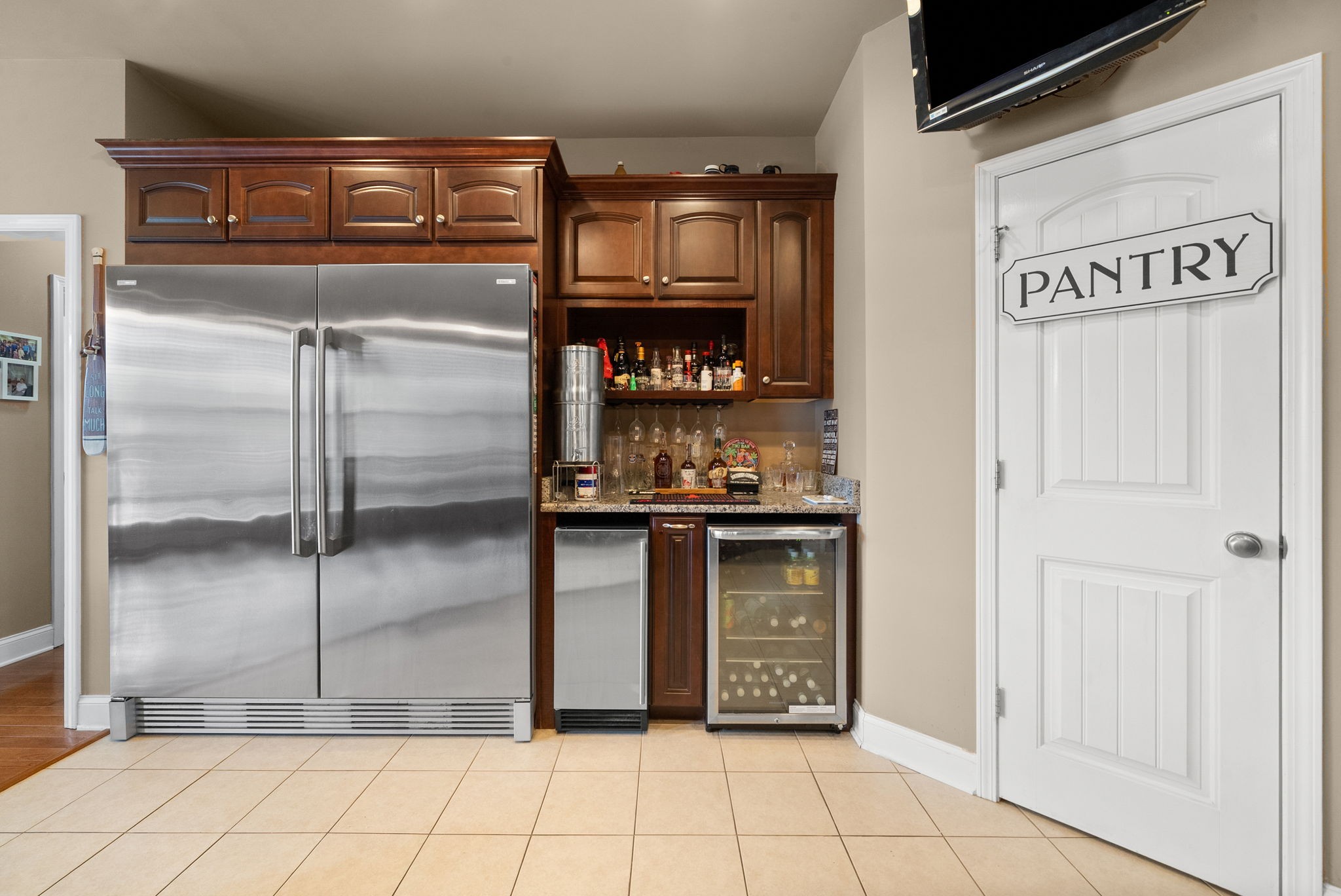 4940 Marion Road Cunningham, TN 37052 - Photo 12 of 43 a view of a refrigerator in kitchen and an empty room
