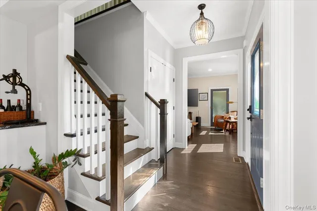 a view of a hallway view with living room and with furniture