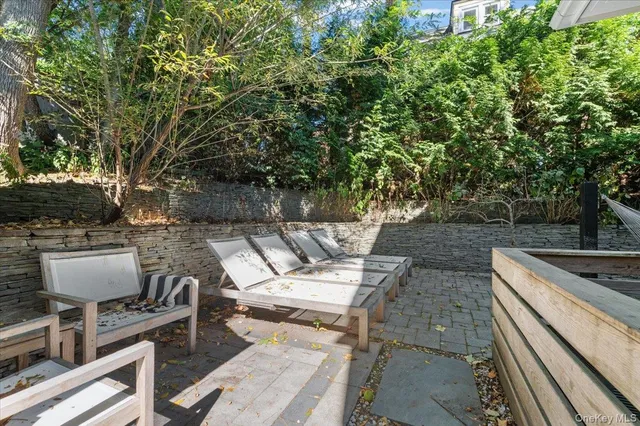 a view of a yard with sitting area