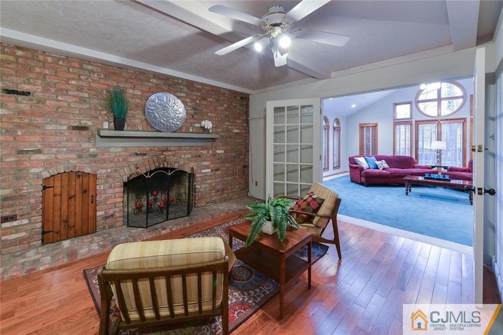 52 Hillsdale Road Edison, NJ 08820 - Photo 12 of 25 a living room with furniture and a fireplace
