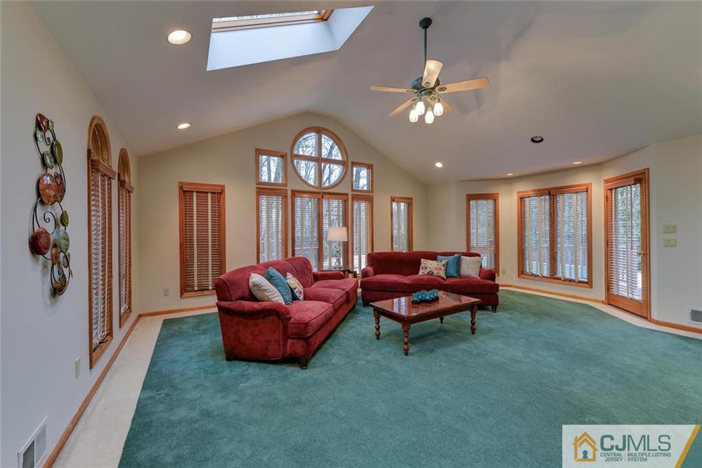 52 Hillsdale Road Edison, NJ 08820 - Photo 14 of 25 a living room with furniture and a large window