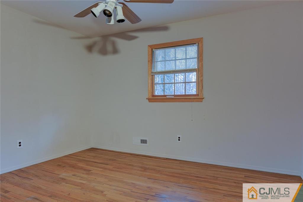 52 Hillsdale Road Edison, NJ 08820 - Photo 17 of 25 an empty room with a window