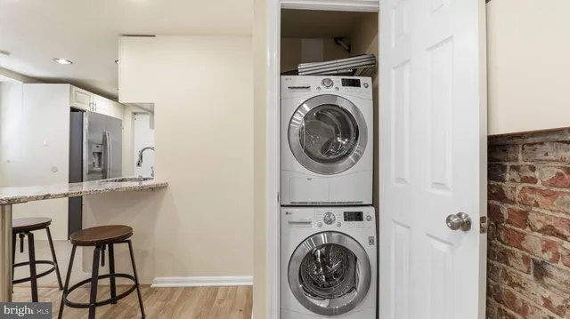 a view of a hallway with washer and dryer