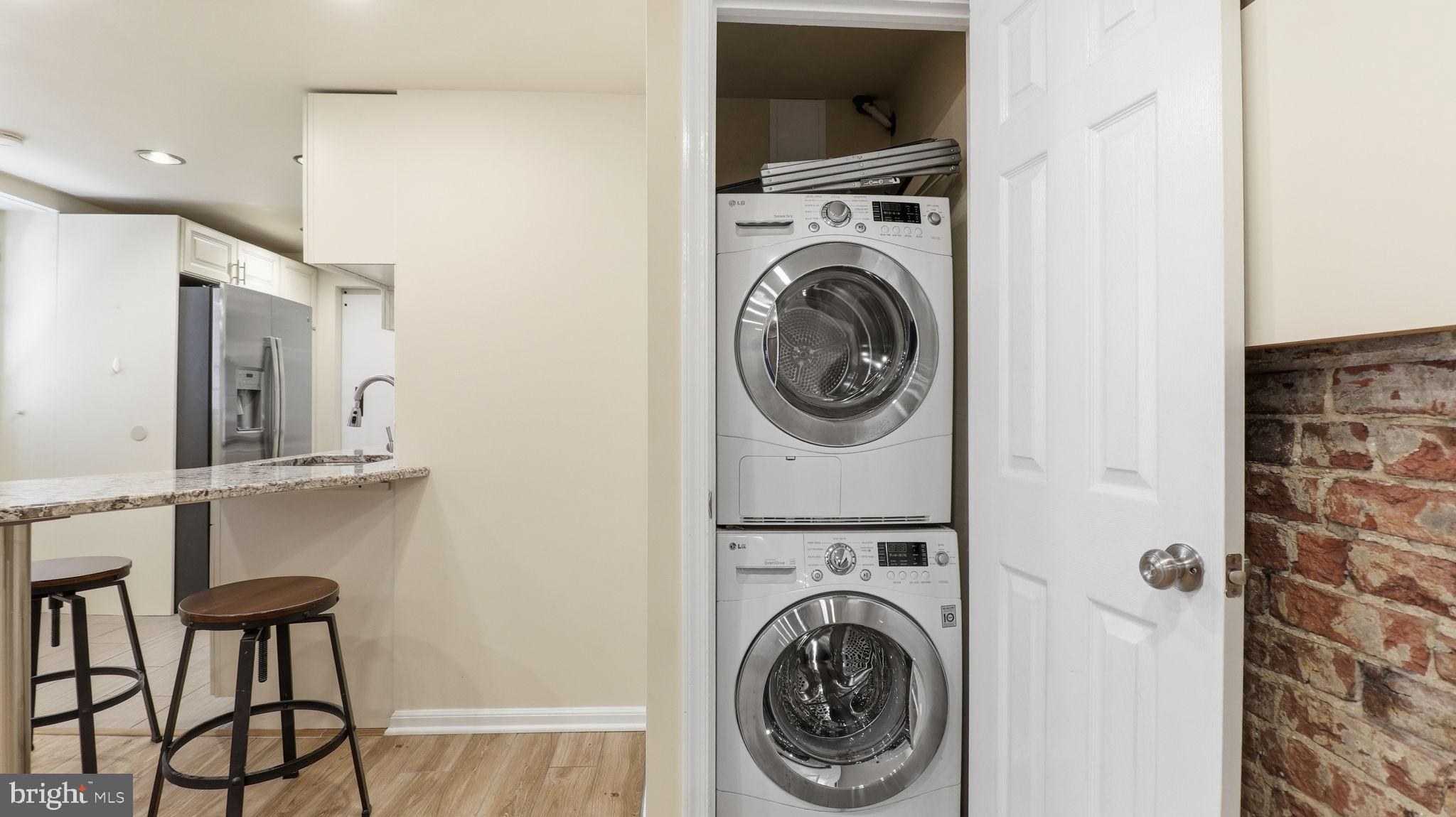 1450 Harvard Street Northwest, Unit B Washington, DC 20009 - Photo 11 of 35 a view of a hallway with washer and dryer