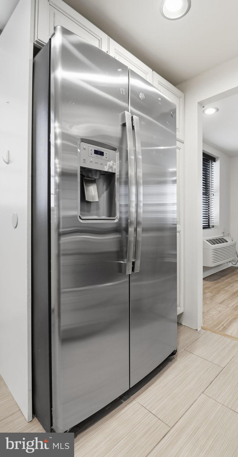 1450 Harvard Street Northwest, Unit B Washington, DC 20009 - Photo 15 of 35 a bathroom with a glass shower door