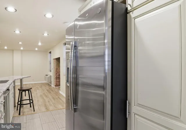a bathroom with a glass shower door and a bathtub