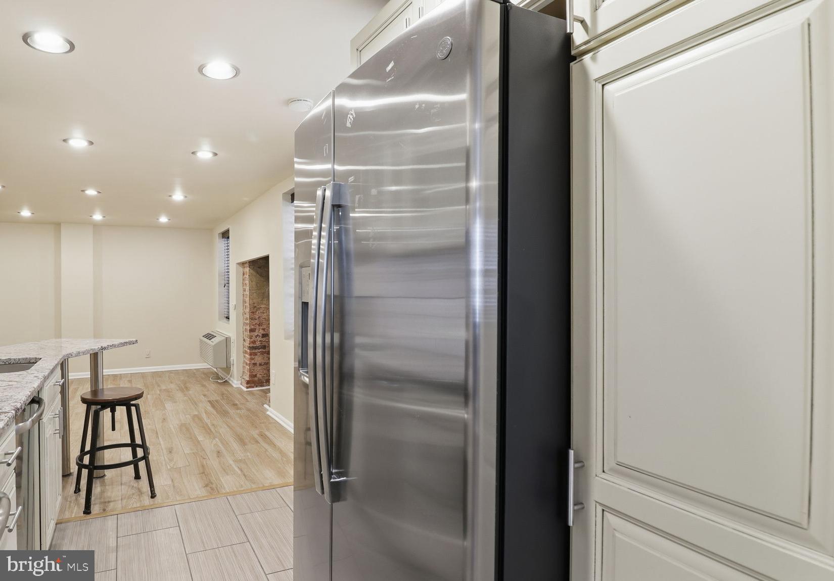 1450 Harvard Street Northwest, Unit B Washington, DC 20009 - Photo 16 of 35 a bathroom with a glass shower door and a bathtub