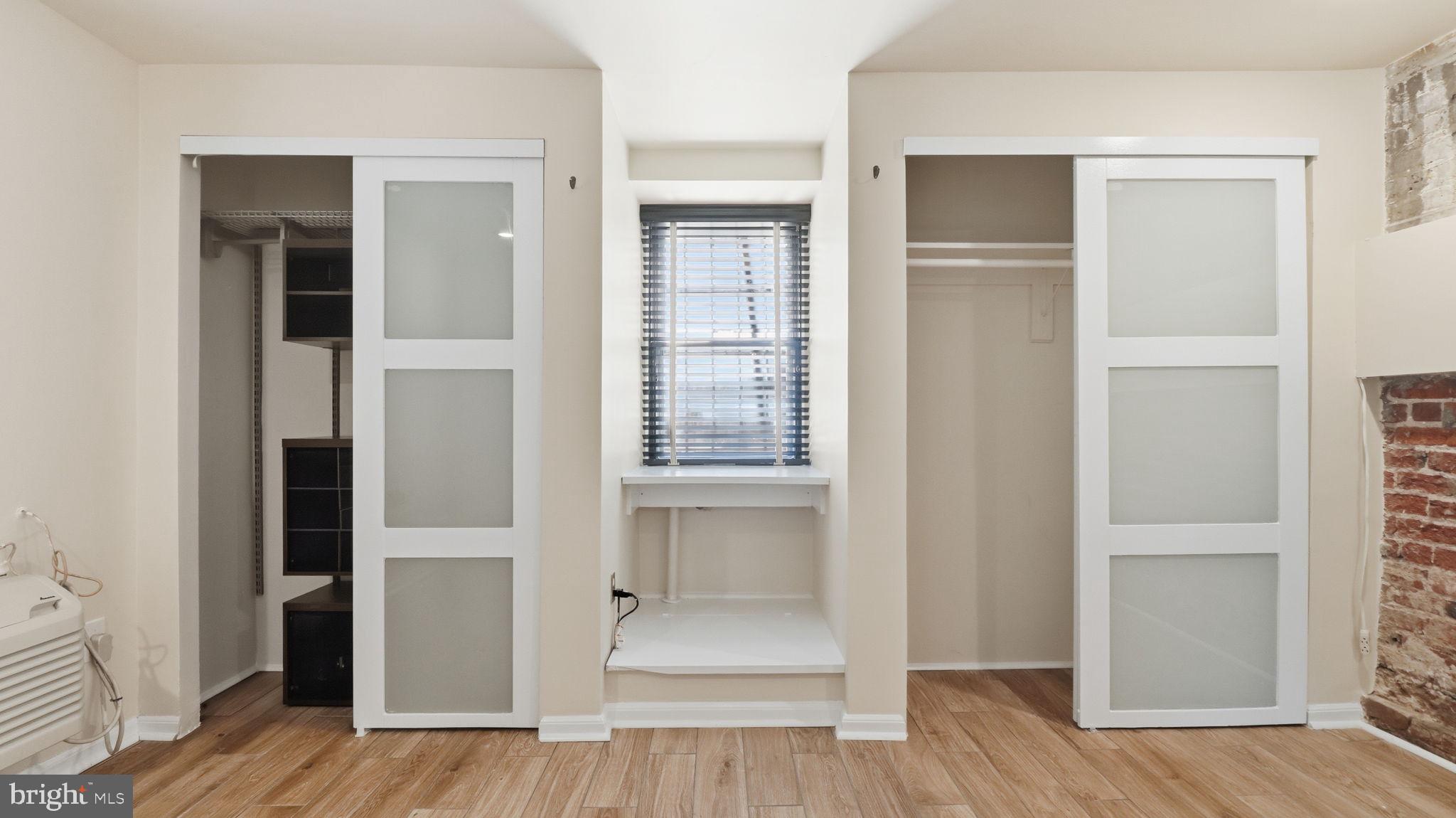 1450 Harvard Street Northwest, Unit B Washington, DC 20009 - Photo 19 of 35 a view of walk in closet with wooden floor