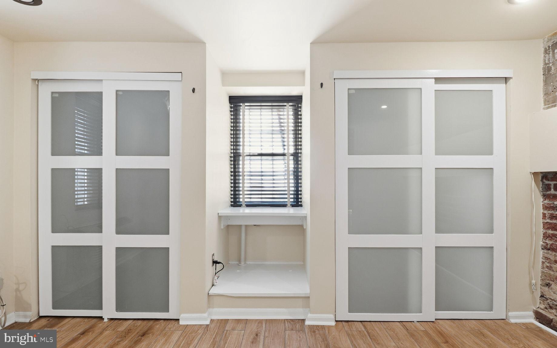 1450 Harvard Street Northwest, Unit B Washington, DC 20009 - Photo 20 of 35 a view of an empty room with cabinet and door