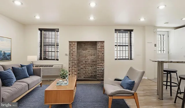 a living room with furniture and a window