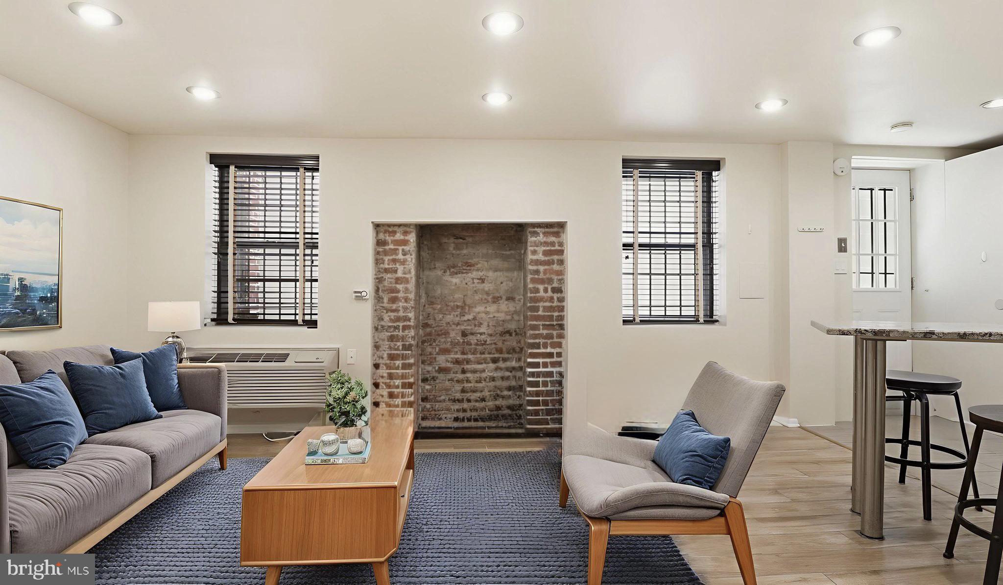 1450 Harvard Street Northwest, Unit B Washington, DC 20009 - Photo 2 of 35 a living room with furniture and a window