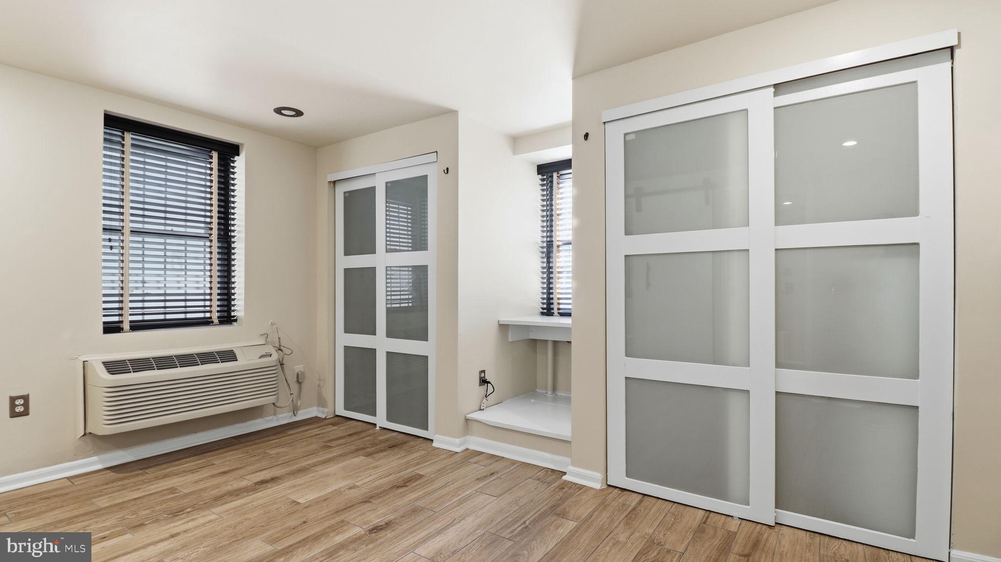 1450 Harvard Street Northwest, Unit B Washington, DC 20009 - Photo 21 of 35 a view of an empty room with cabinet and a window