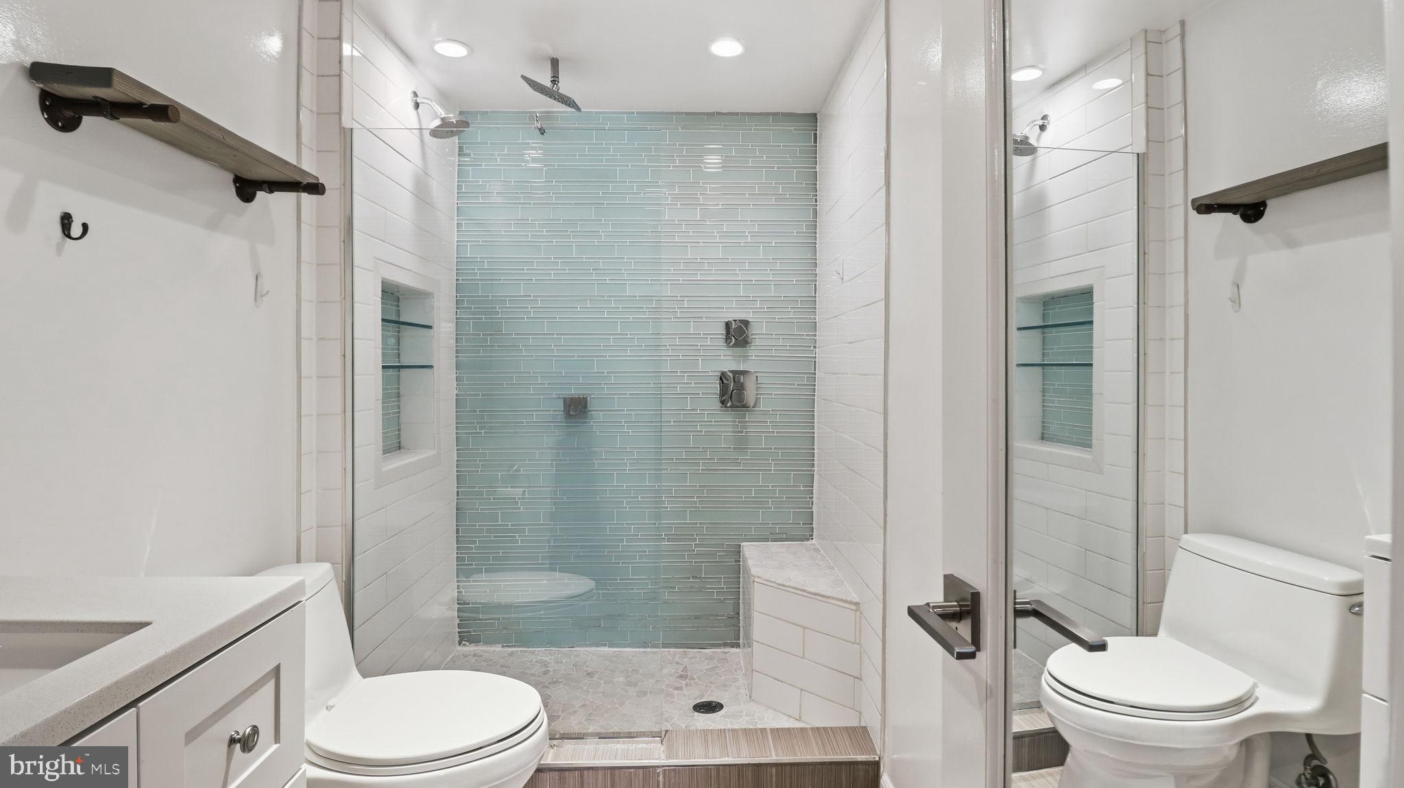 1450 Harvard Street Northwest, Unit B Washington, DC 20009 - Photo 22 of 35 a bathroom with a shower a toilet and a sink