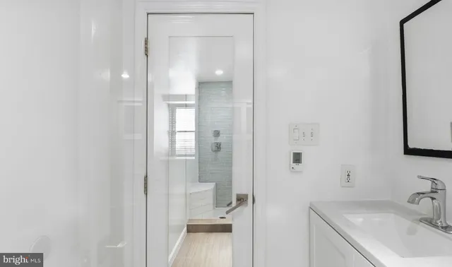 a bathroom with a sink and a mirror