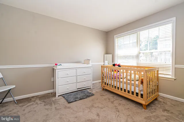 a bedroom with furniture and natural light