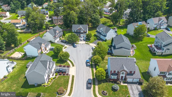 an aerial view of residential house with outdoor space and swimming pool