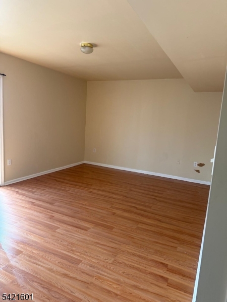 41 3rd Street Newark, NJ 07107 - Photo 14 of 31 a view of an empty room with wooden floor