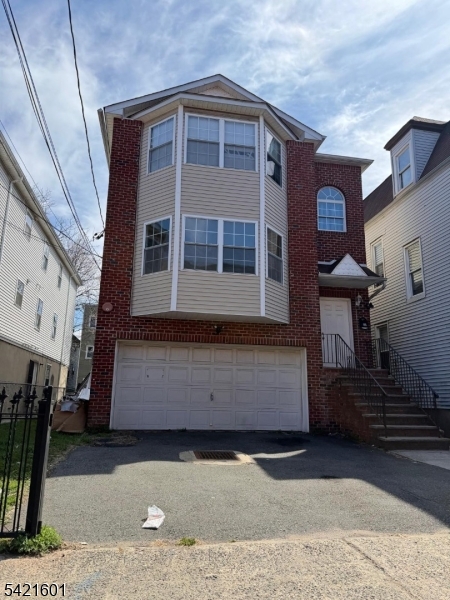 41 3rd Street Newark, NJ 07107 - Photo 2 of 31 a front view of a house with a yard