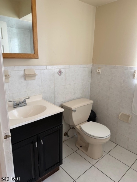 41 3rd Street Newark, NJ 07107 - Photo 22 of 31 a bathroom with a sink a toilet and mirror