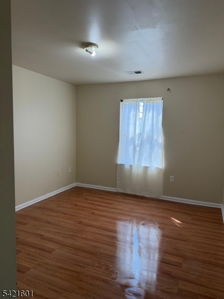 41 3rd Street Newark, NJ 07107 - Photo 26 of 31 wooden floor in an empty room