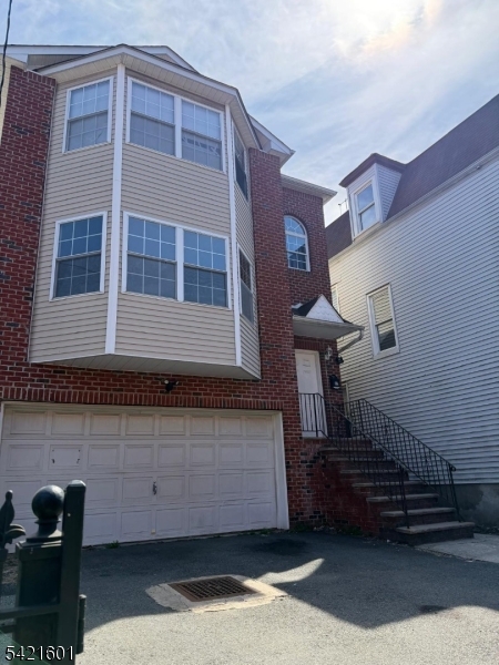 41 3rd Street Newark, NJ 07107 - Photo 3 of 31 a view of a brick house with entryway doors
