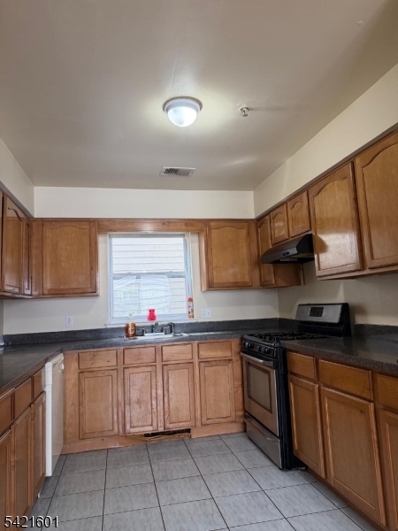 41 3rd Street Newark, NJ 07107 - Photo 5 of 31 a kitchen with a sink stove top oven and cabinets