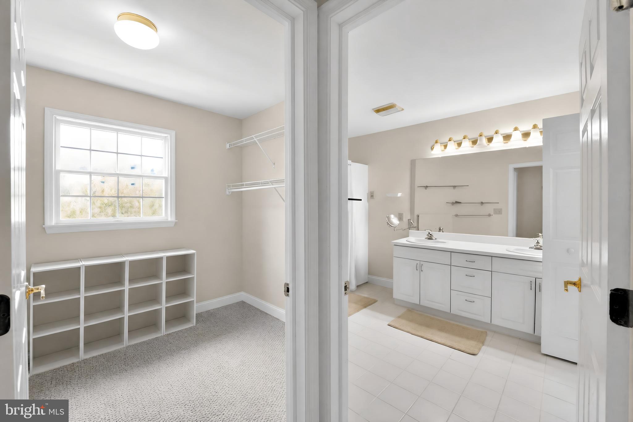 6 Hedge Row Road Princeton, NJ 08540 - Photo 27 of 32 a bathroom with a double vanity sink mirror and a bathtub