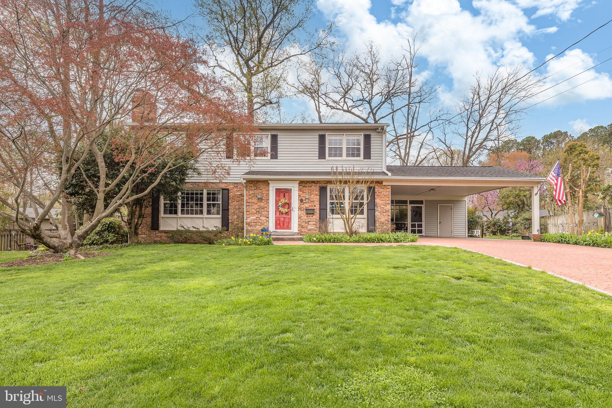 8330 Blowing Rock Road Alexandria, VA 22309 - Photo 1 of 53 a front view of a house with a garden