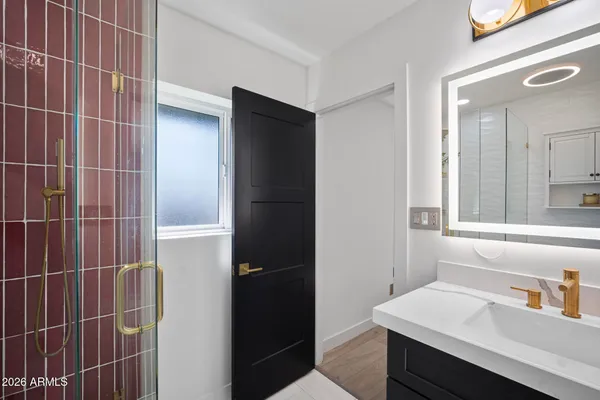 a bathroom with a sink and a mirror