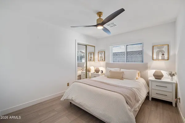 a bedroom with a bed and a window