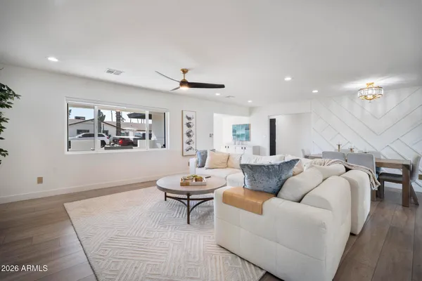 a living room with furniture and a large window