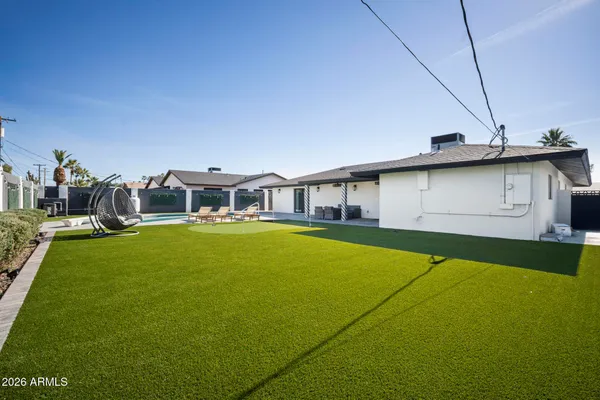 a aerial view of a house with swimming pool