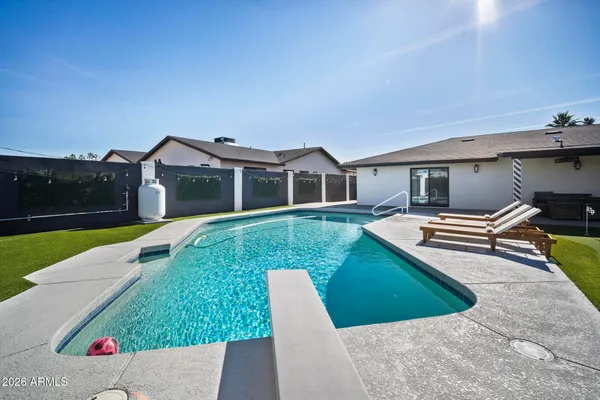 a view of a house with a yard porch and sitting area