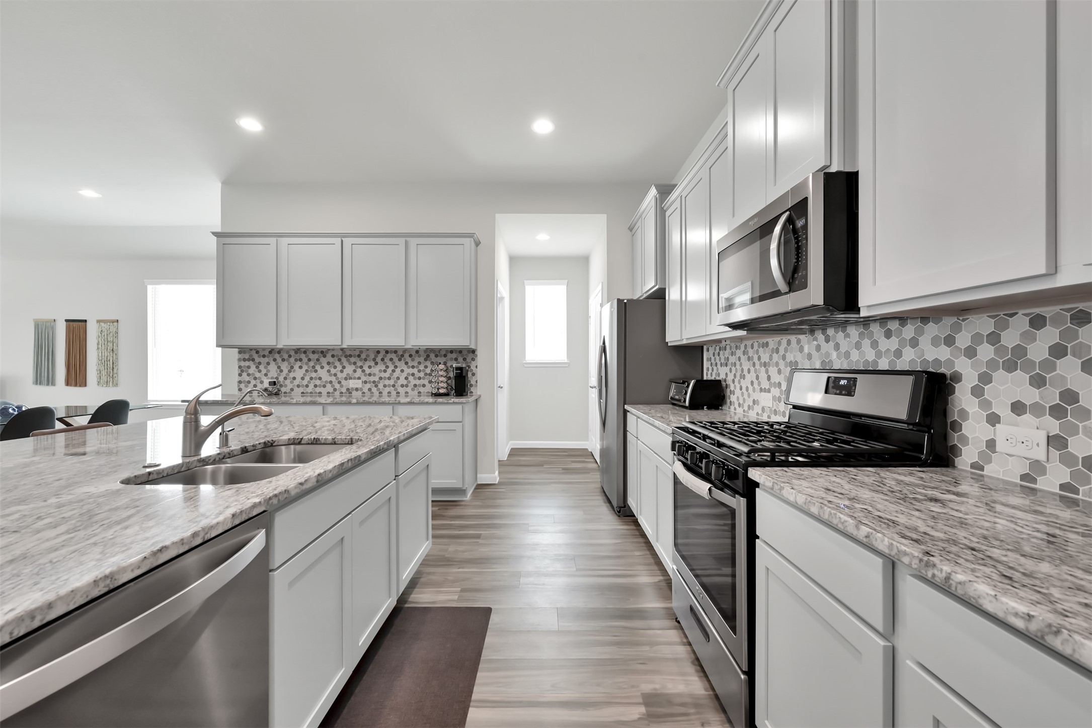 14243 Volcano Perch Drive Conroe, TX 77384 - Photo 3 of 25 Another view of the beautiful kitchen. Cabinets galore!