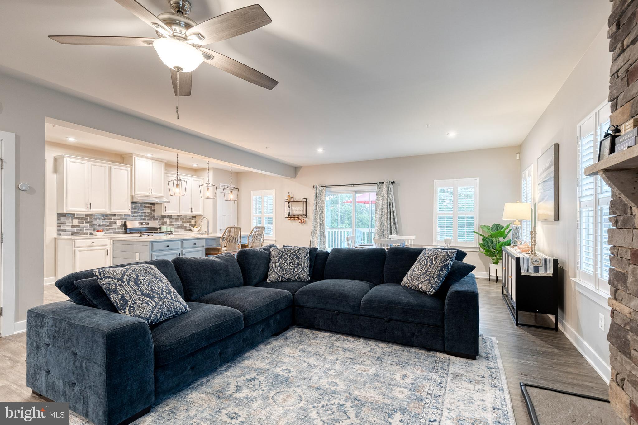 6003 Valentine Way Hanover, MD 21076 - Photo 10 of 52 a living room with furniture and a large window