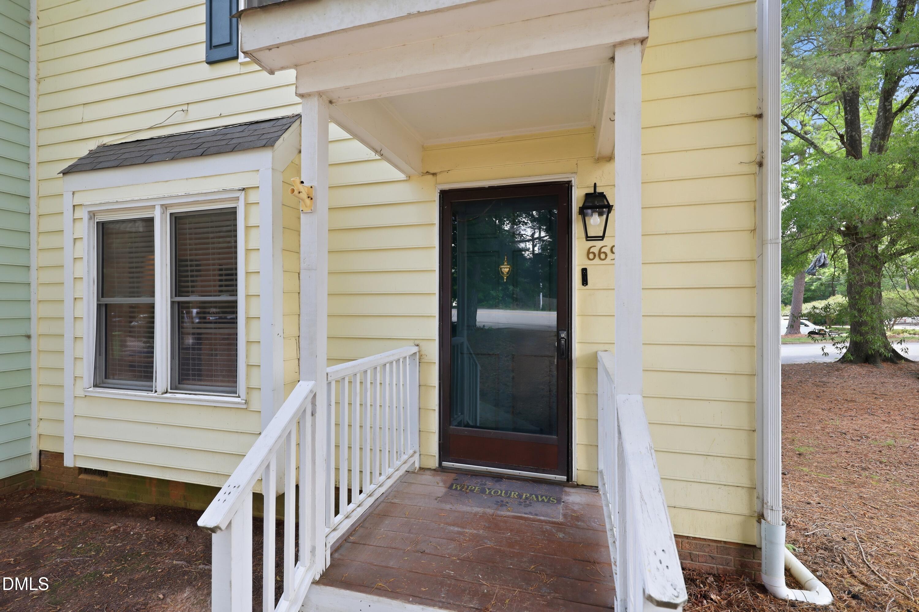 669 Bashford Road Raleigh, NC 27606 - Photo 1 of 19 a view of front door and porch