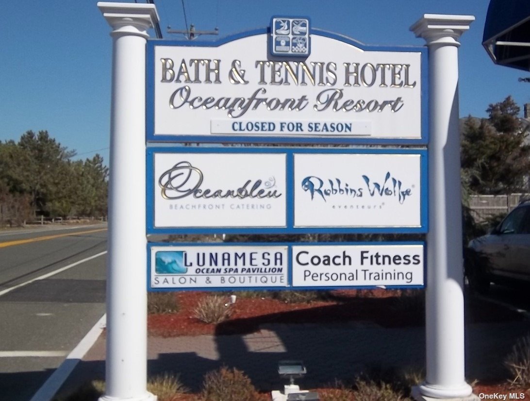 231 Dune Road, Unit 401 Westhampton Beach, NY 11978 - Photo 1 of 1 a sign on a pole on a street