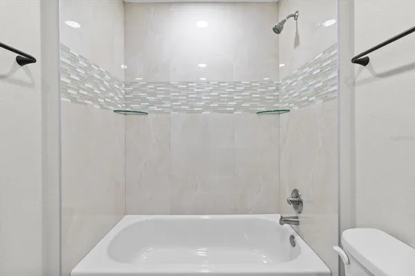 a view of a hallway with wooden floor and a hallway