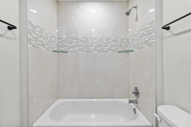 a view of a hallway with wooden floor and a hallway