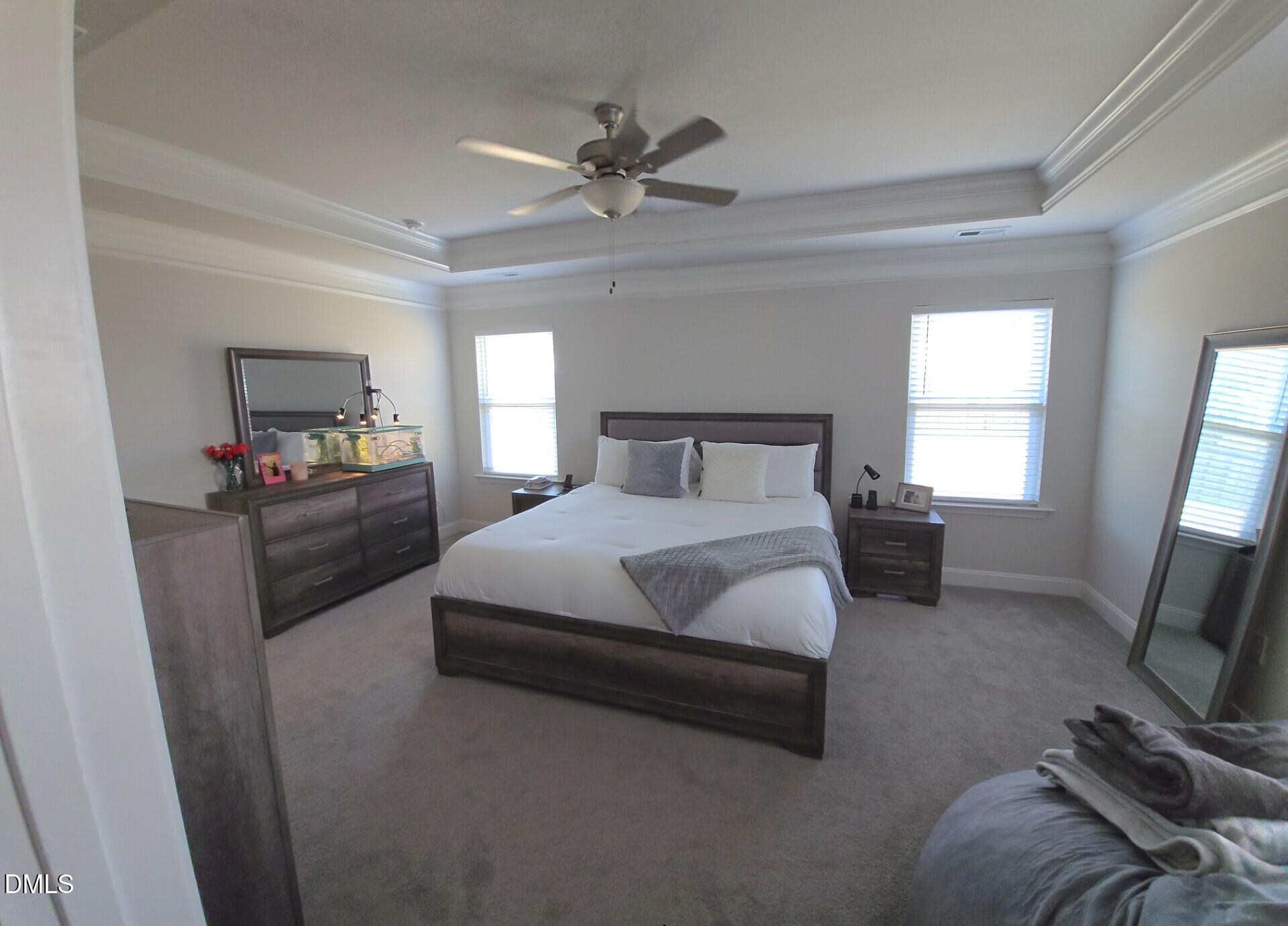 207 Spring Forest Drive Goldsboro, NC 27534 - Photo 10 of 19 a bedroom with a bed and a flat tv screen on dresser