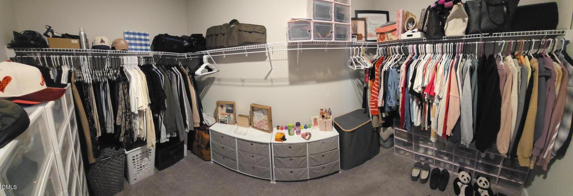 207 Spring Forest Drive Goldsboro, NC 27534 - Photo 11 of 19 a view of walk in closet with clothes and shoes
