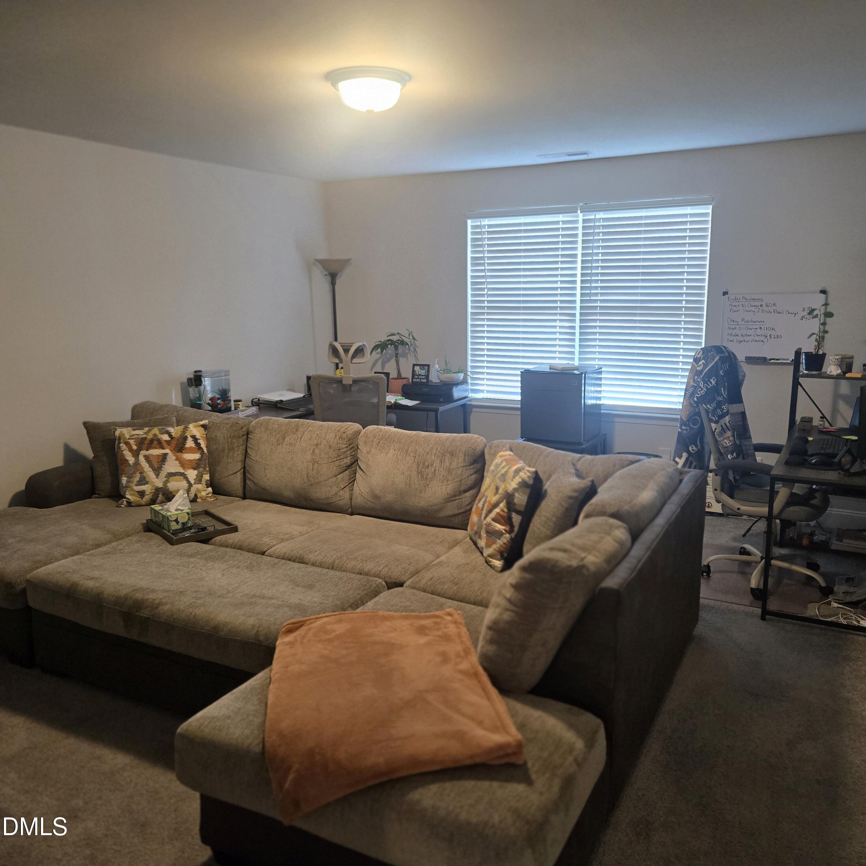 207 Spring Forest Drive Goldsboro, NC 27534 - Photo 16 of 19 a living room with furniture and a large window