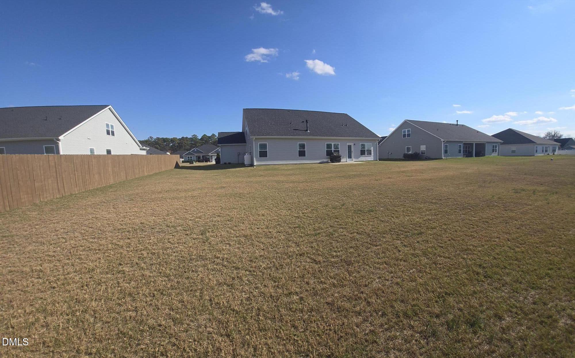 207 Spring Forest Drive Goldsboro, NC 27534 - Photo 18 of 19 a view of a house with a yard