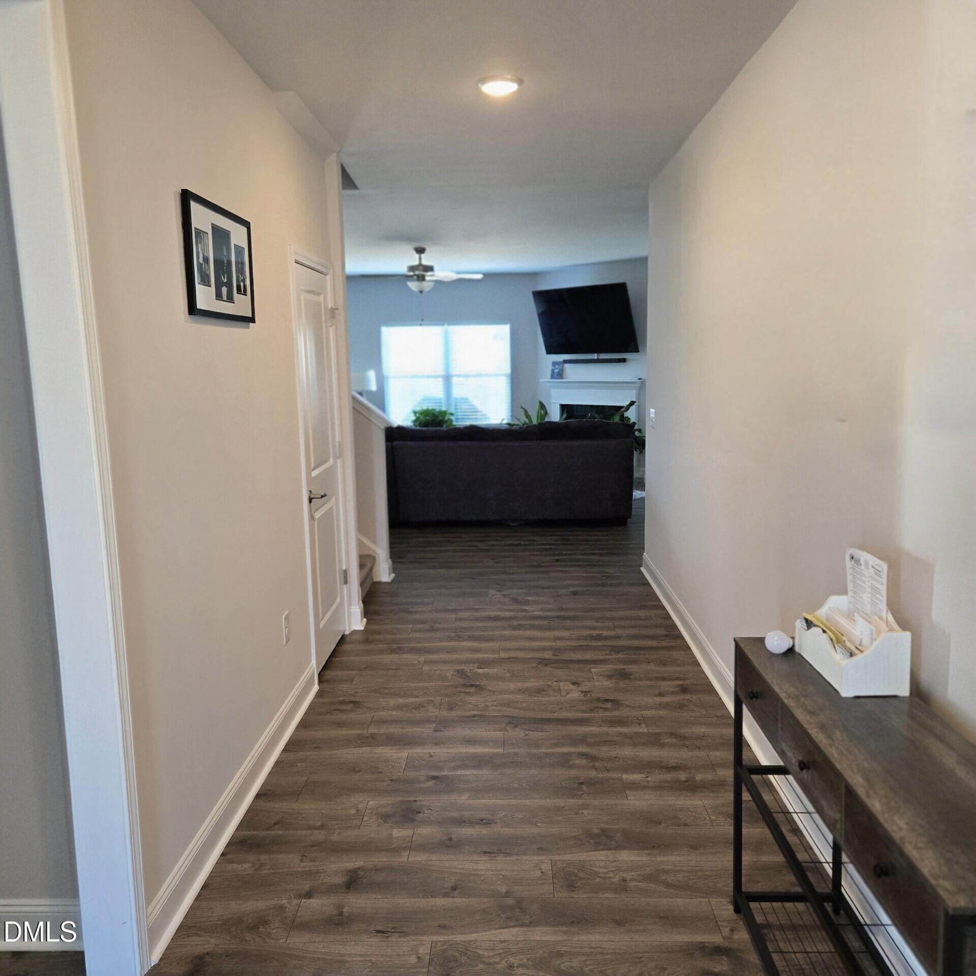207 Spring Forest Drive Goldsboro, NC 27534 - Photo 2 of 19 a view of a hallway with wooden floor and furniture