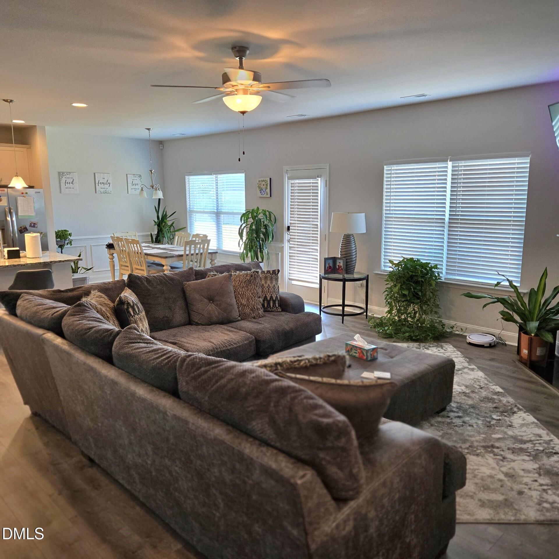 207 Spring Forest Drive Goldsboro, NC 27534 - Photo 8 of 19 a living room with furniture potted plant and a window