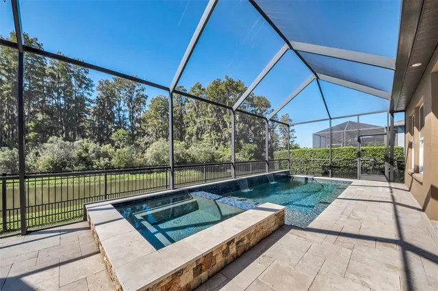 an aerial view of a house with a swimming pool