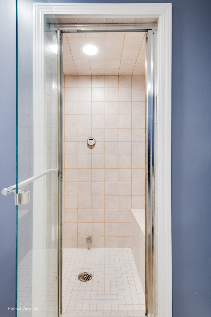 37W765 Spring Green Way Batavia, IL 60510 - Photo 24 of 29 a bathroom with a glass shower door