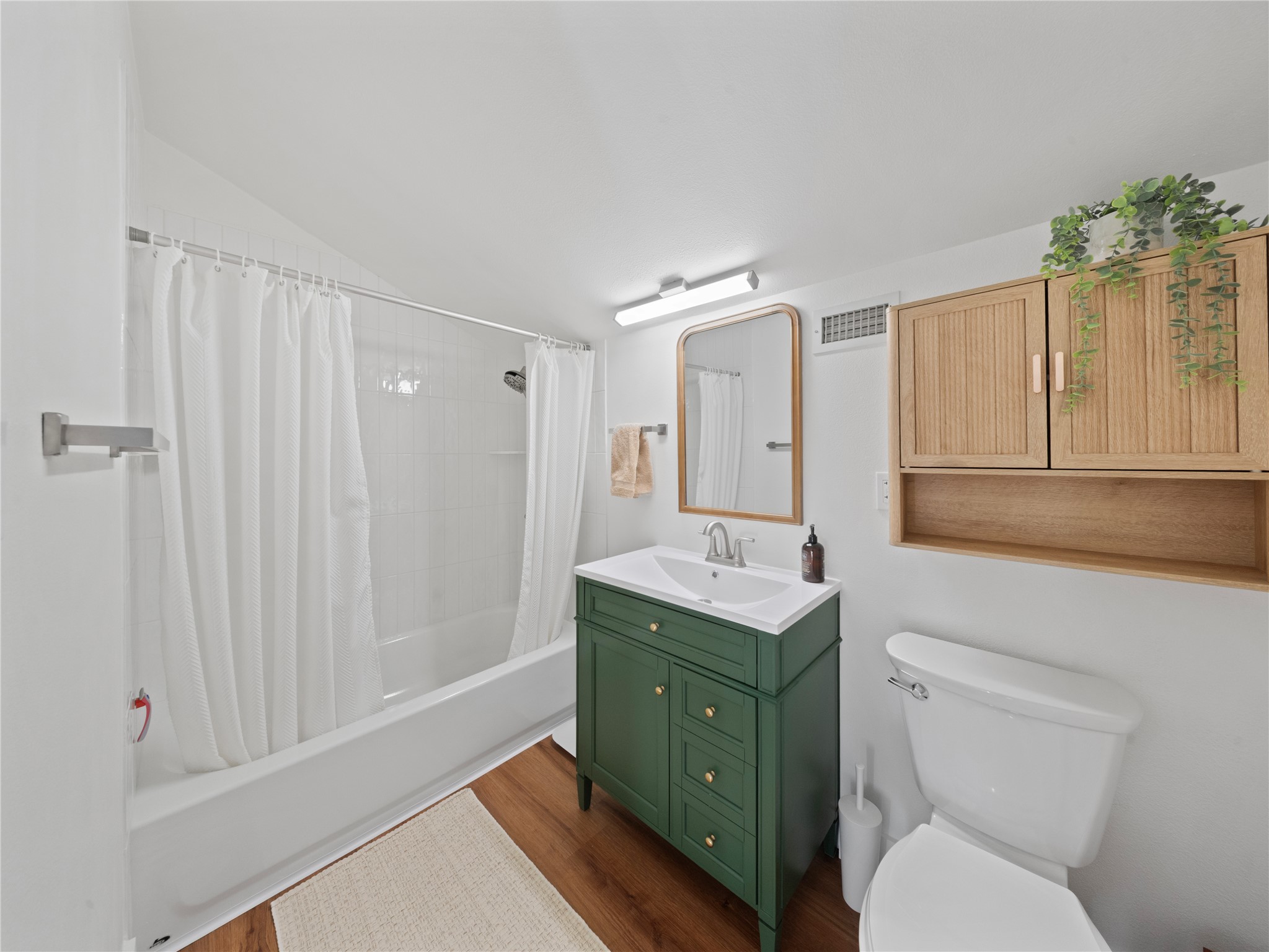 5108 Sioux Lane Austin, TX 78734 - Photo 28 of 35 a bathroom with a toilet a sink and mirror