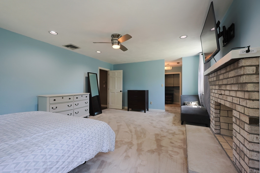 5 Windsor Road Lynnfield, MA 01940 - Photo 27 of 40 a bedroom with a bed and a couch